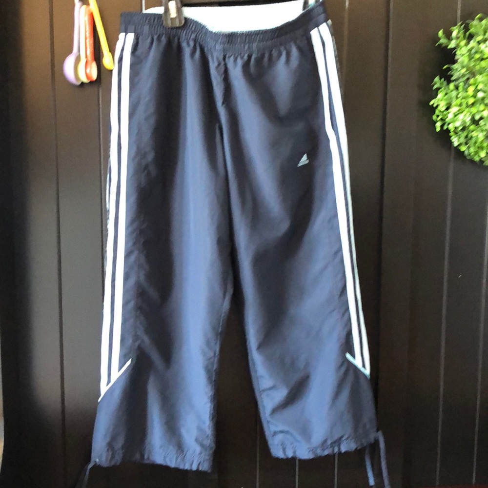 3/4 length Adidas workout pants.